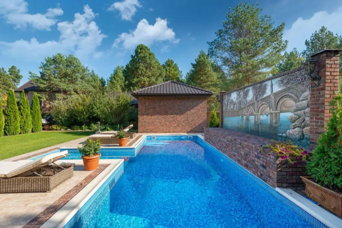 Backyard saltwater swimming pool in Laredo, TX on a clear day